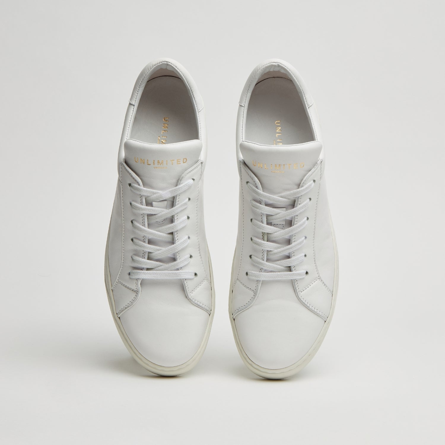 SNEAKERS ARTIGIANALI IN VITELLO NAPPATO “BIANCA” – UNLIMITED